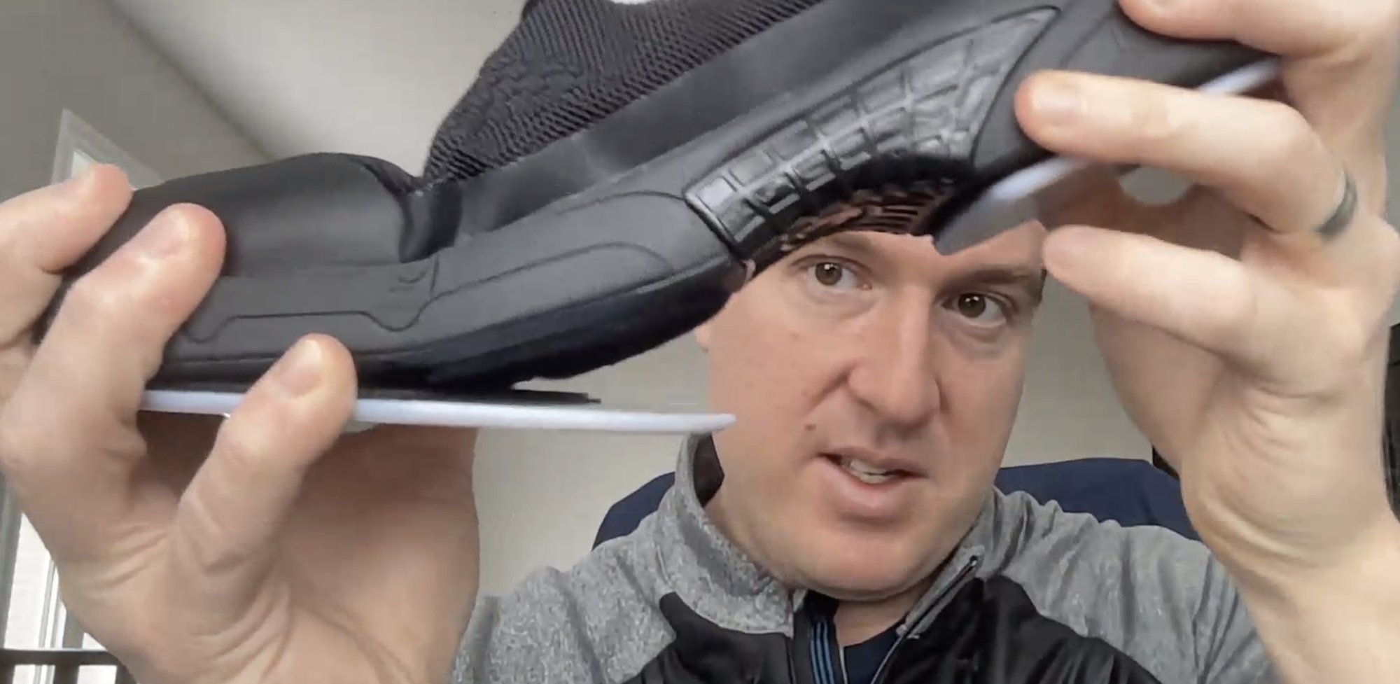 Andrew Brett, Goldline Curling, shows a new curling shoe prototype to Skeki
